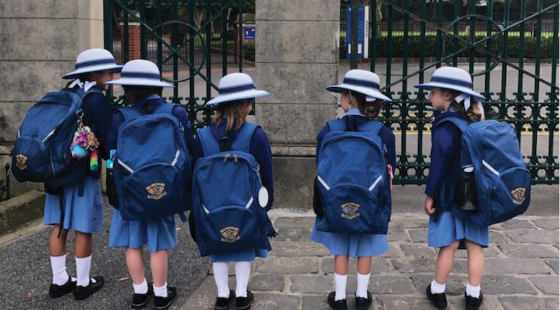 Preparatory students standing in front of Loreto Toorak gates on their first day of school